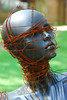Lady in Black : These photos were taken in LSU's Sculpture Park Summer 2008. I saw a political statement concerning terrorism, depicting one point of view in the ongoing debate concerning a woman's place in today's post modern society. They are perpetually terrorized by male violence as a result of his poor communication skills and his ineptitude in conflict resolution. Don't wait for him to change soon.